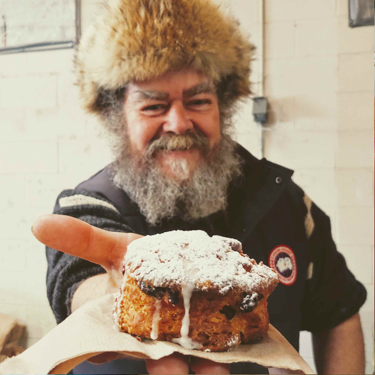 man holding a sweet treat