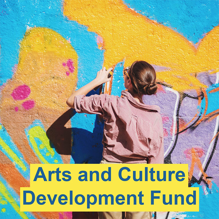 Street art painting and says Arts & Culture Development Fund