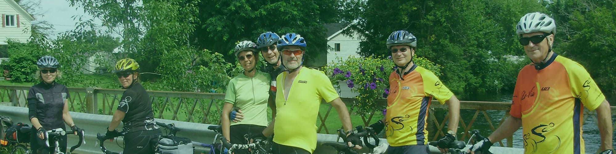 Cyclists stopped on a bridge in Burritts Rapids