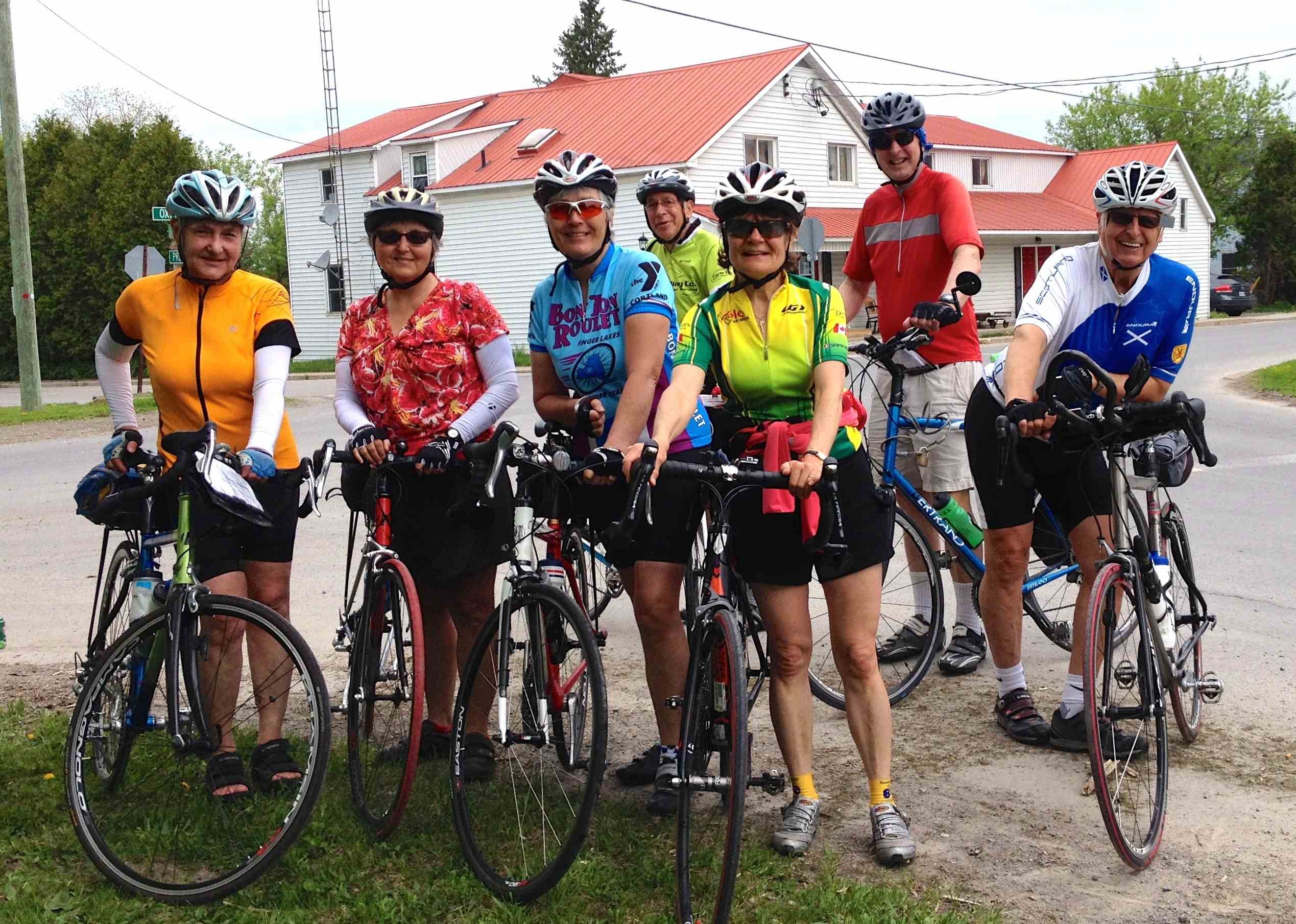 7 cyclists line up for a photo in Bishops Mills, North Grenville as part of MS Bike
