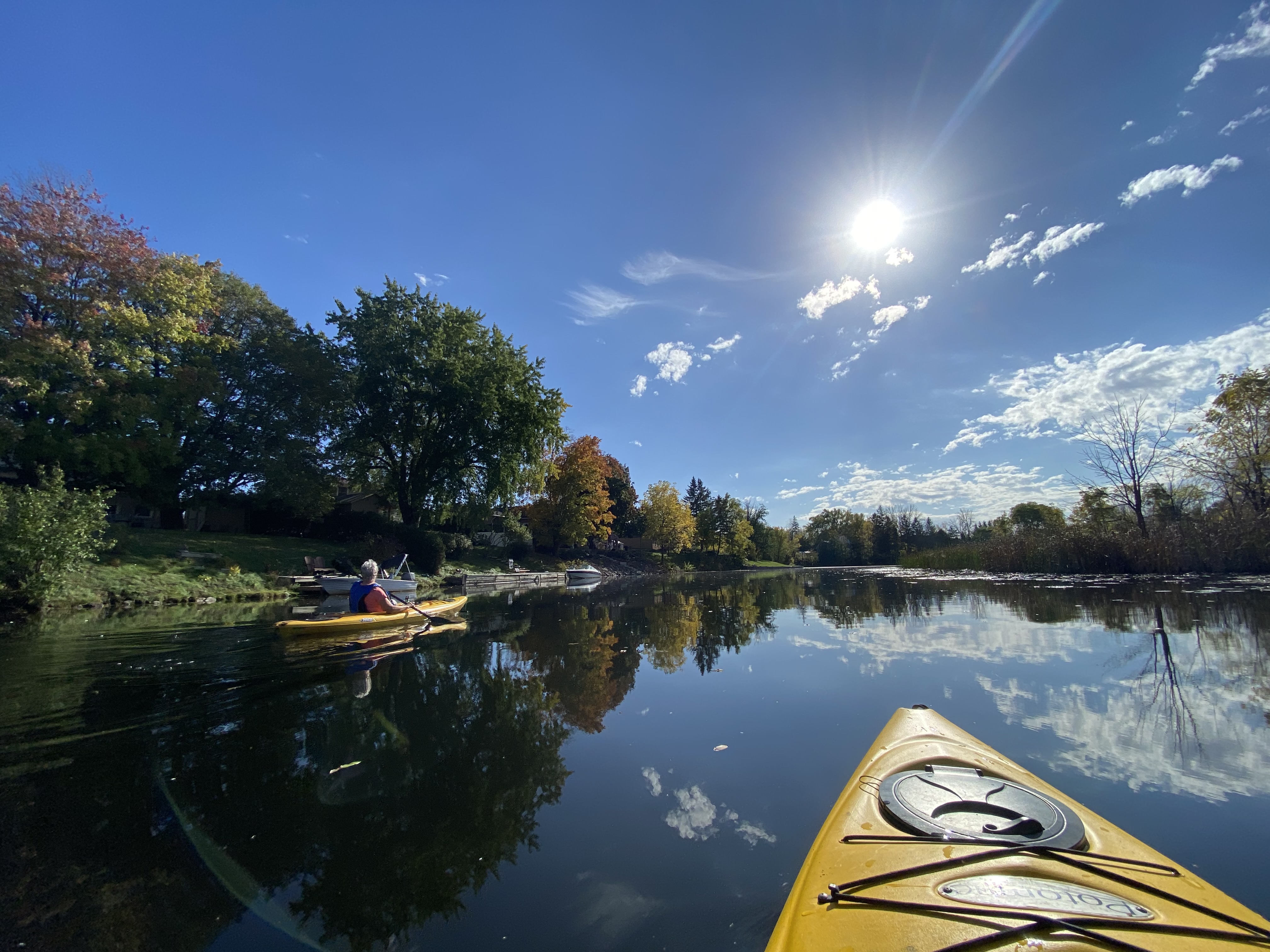 point of view of a yellow kayak paddling down kemptville creek